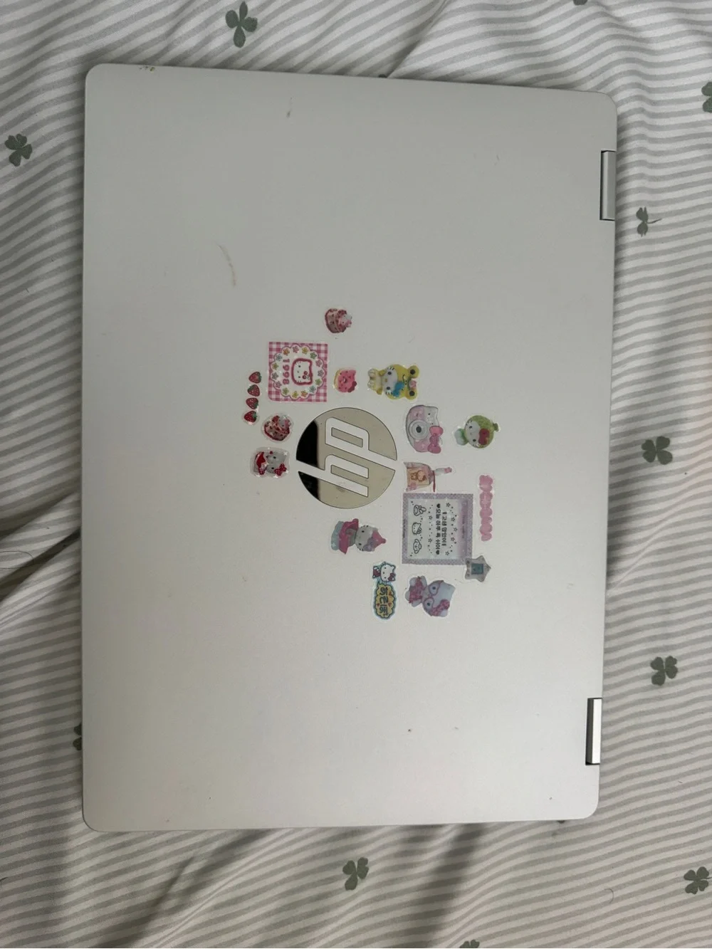 HP Silver Convertible Laptop with Floral Accent Wallpaper